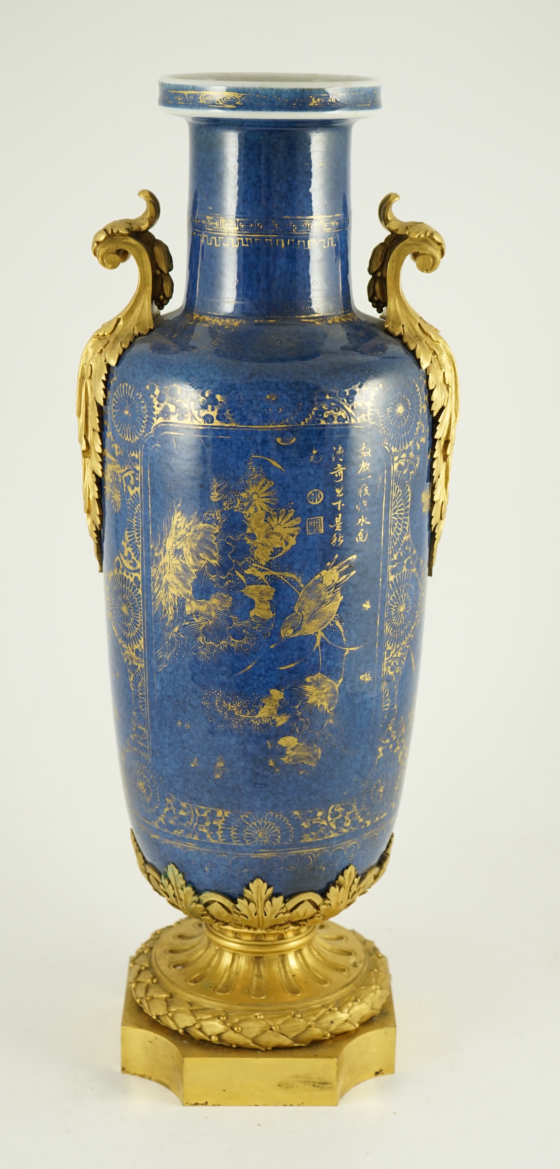 A Chinese gilt-decorated powder blue rouleau vase, Kangxi period, with French ormolu mounts, 55 cm high including ormolu mounts